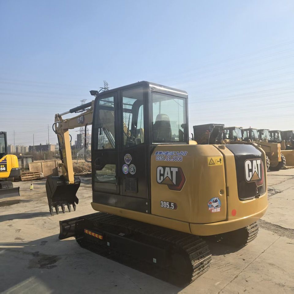 2024 Caterpillar 305.5 mini excavator, rear three-quarter view