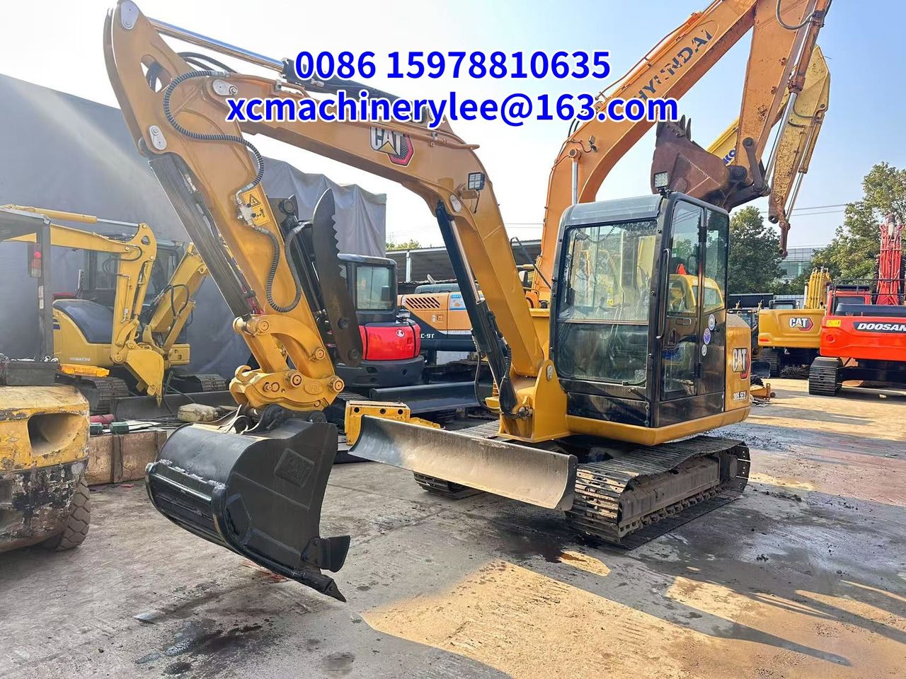 2024 Caterpillar 303.5E mini excavator, front three-quarter view