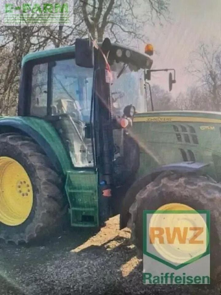 2017 John Deere 6115 M tractor, side view 2017 John Deere 6115 M tractor, side view