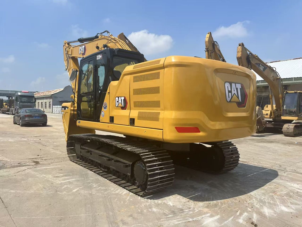 2024 Caterpillar 320GC crawler excavator, rear three-quarter view