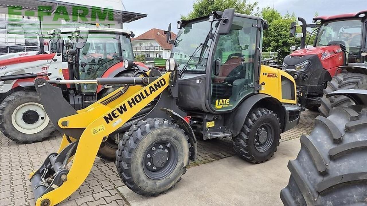 2020 New Holland W60 C mini excavator, front three-quarter view 2020 New Holland W60 C mini excavator, front three-quarter view