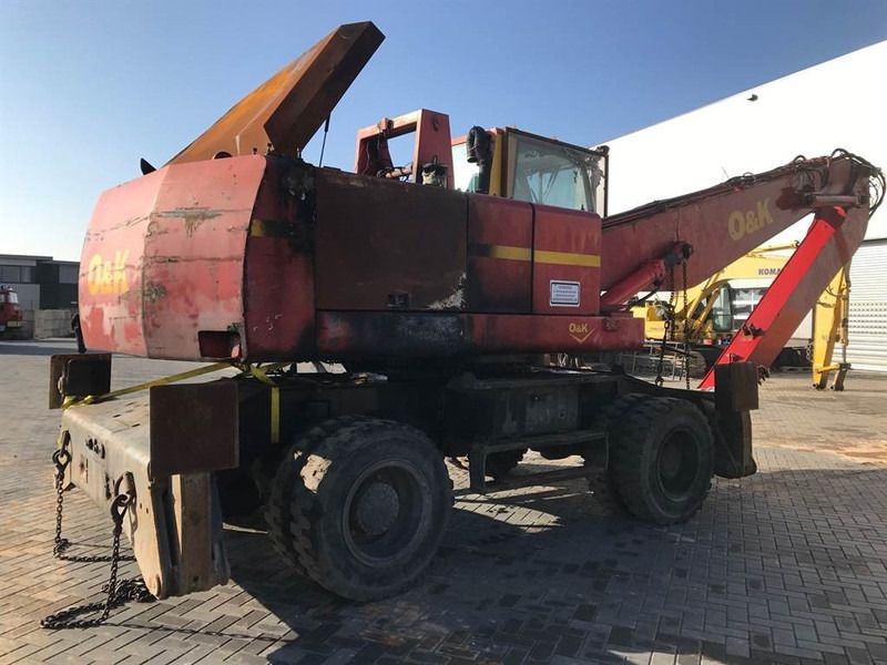 2000 O&K MH 6.5 wheel excavator, rear three-quarter view 2000 O&K MH 6.5 wheel excavator, rear three-quarter view