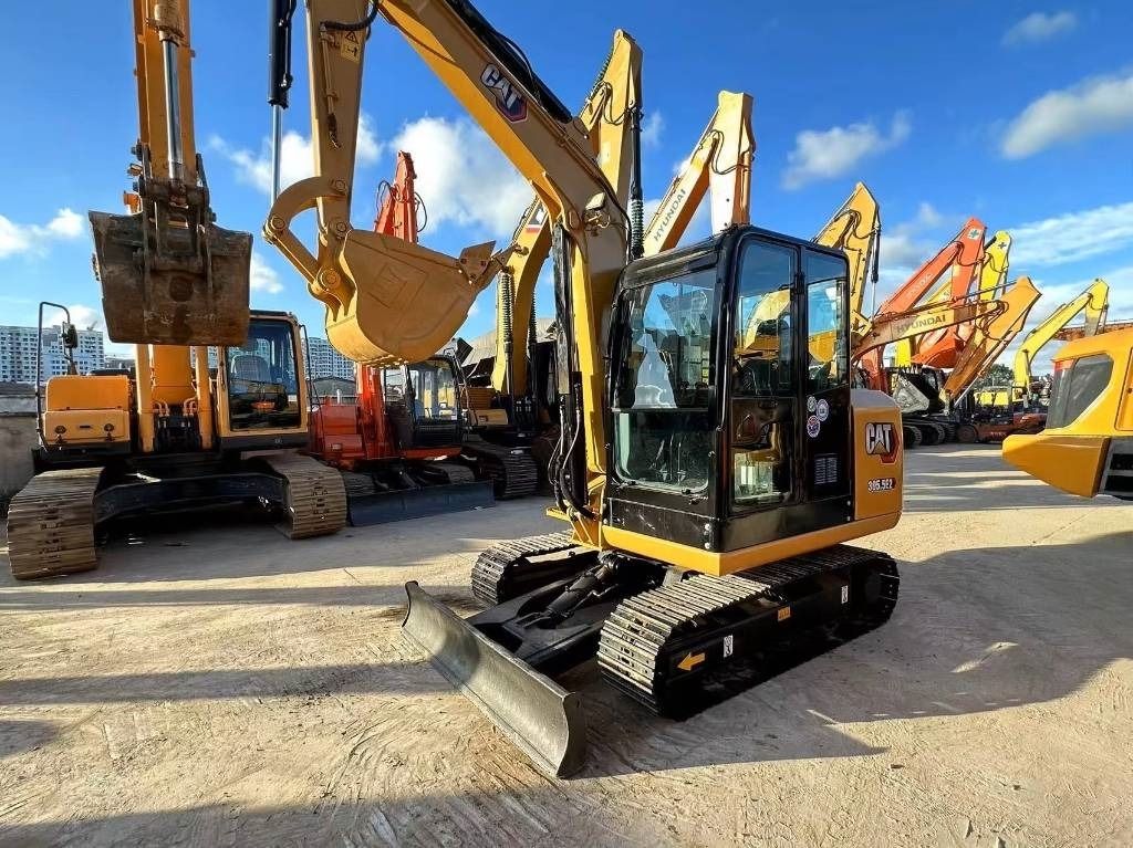 2022 Caterpillar 305.5 E2 mini excavator, front three-quarter view