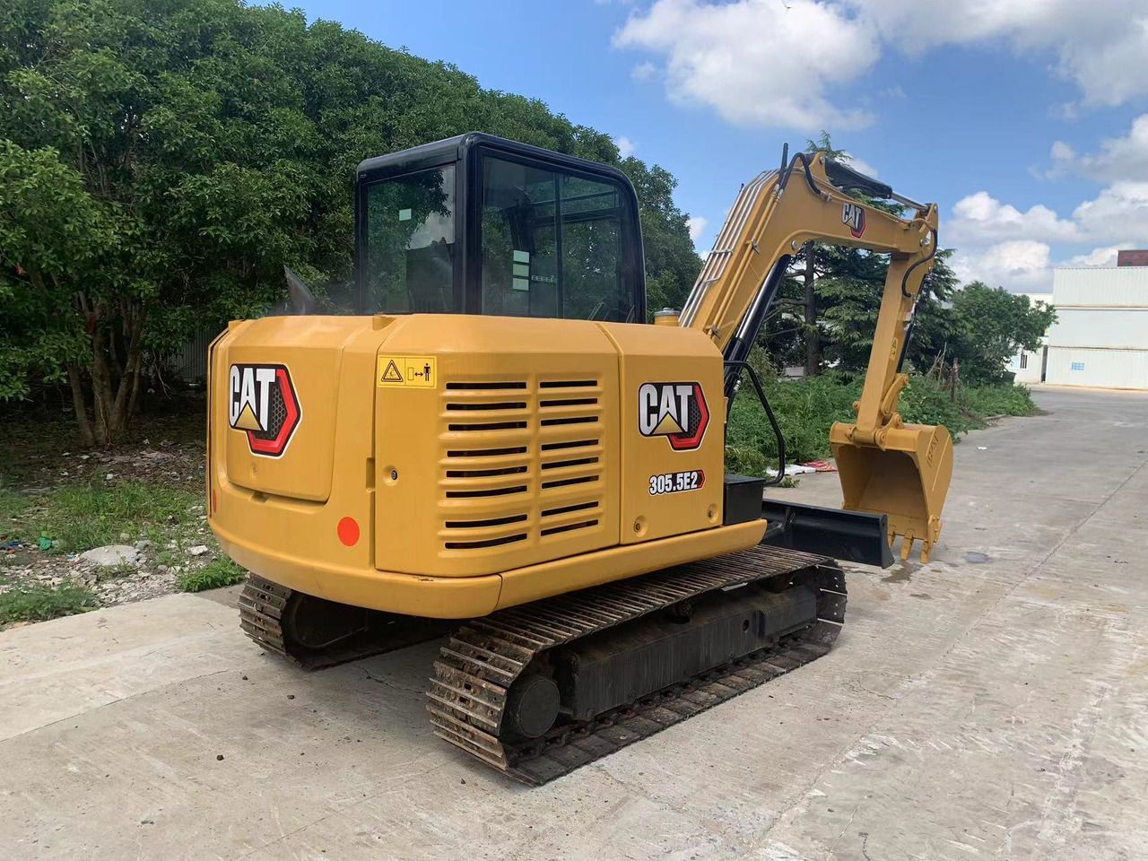 2022 Caterpillar 305.5E2 mini excavator, rear three-quarter view