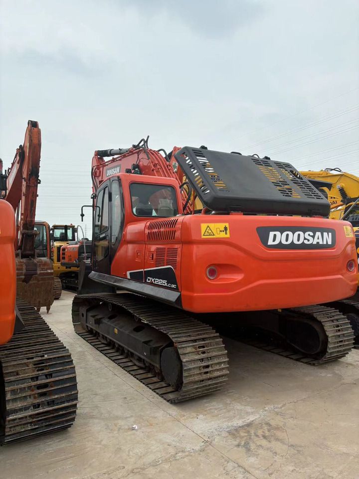 2023 Doosan DX225LC-9C crawler excavator, rear three-quarter view