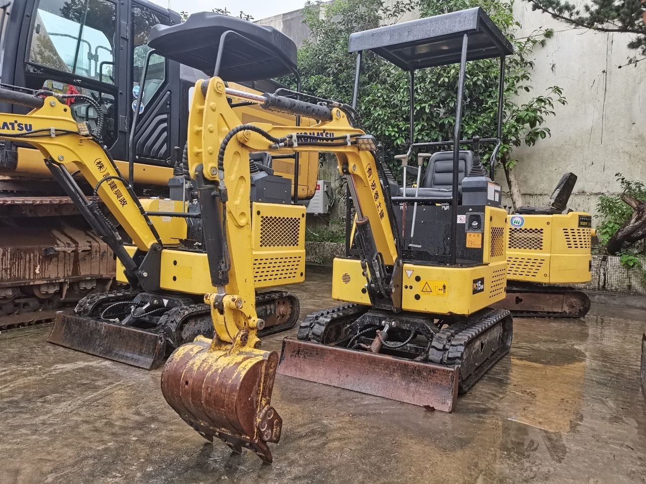 2012 Komatsu PC15MR mini excavator, front three-quarter view