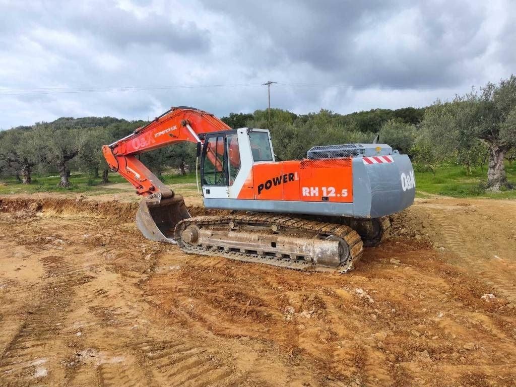2002 O&K RH 12.5 crawler excavator, rear three-quarter view