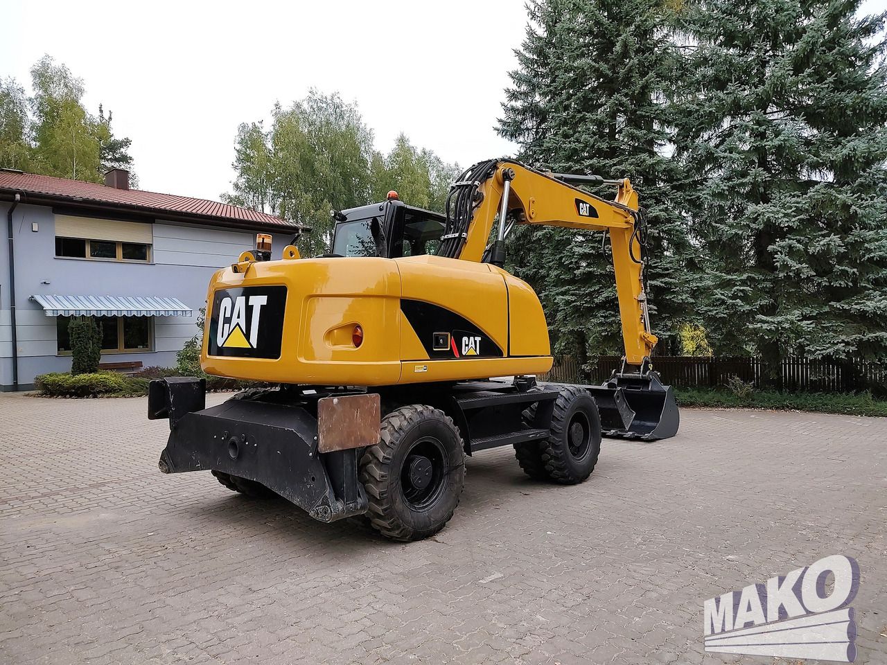 2012 Caterpillar M313D wheel excavator, rear three-quarter view