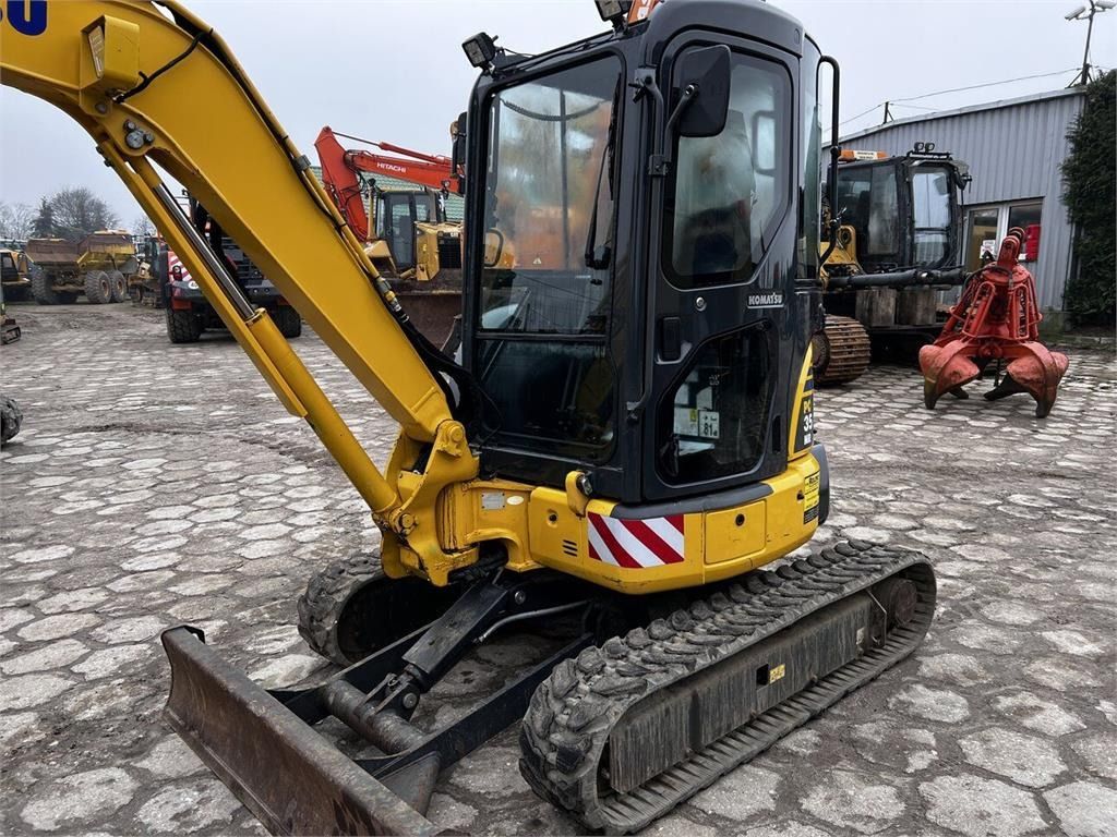 2011 Komatsu PC35MR-3 mini excavator, front three-quarter view