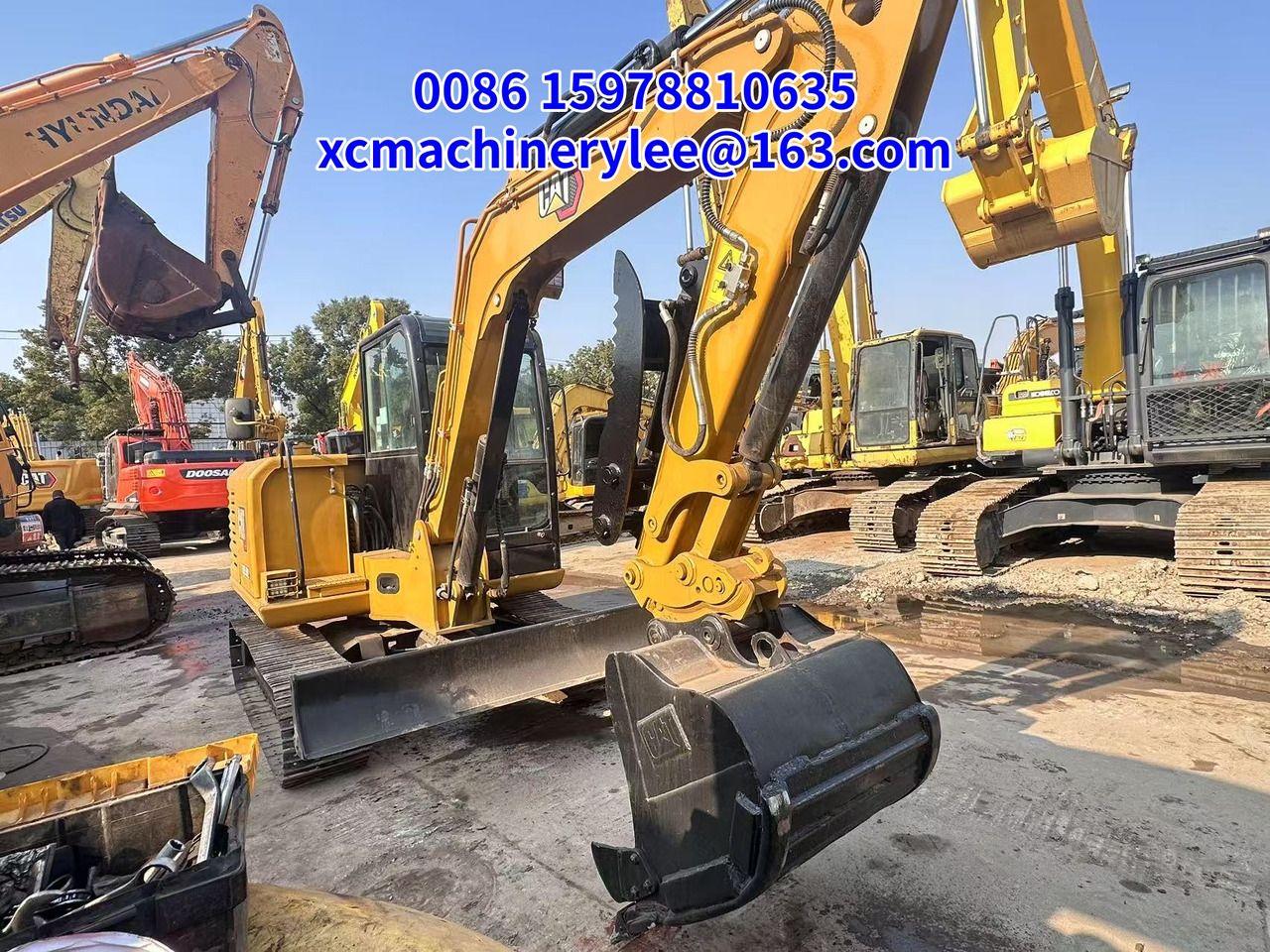 2024 Caterpillar 303.5E mini excavator, front three-quarter view