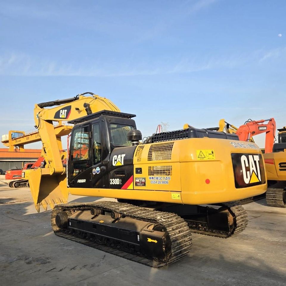 2023 Caterpillar 330D2 excavator, rear three-quarter view