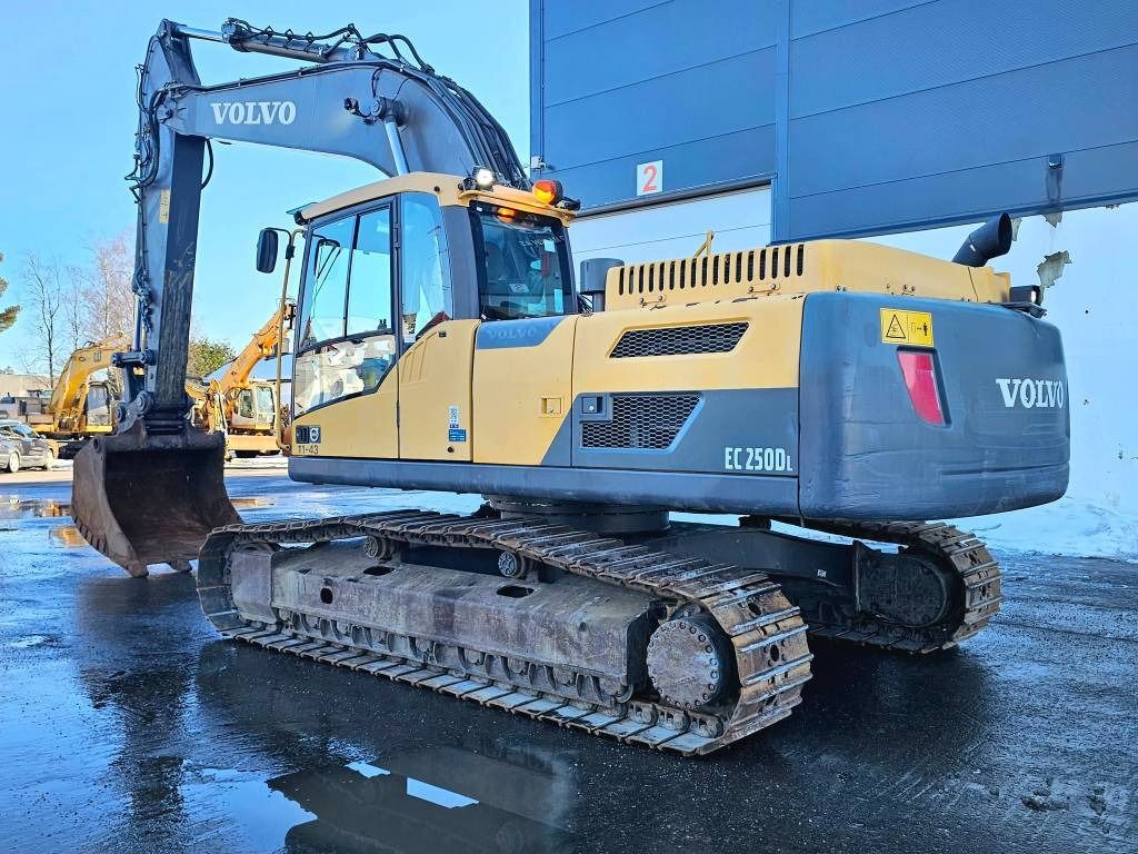 2013 Volvo EC250DL crawler excavator, rear three-quarter view 2013 Volvo EC250DL crawler excavator, rear three-quarter view