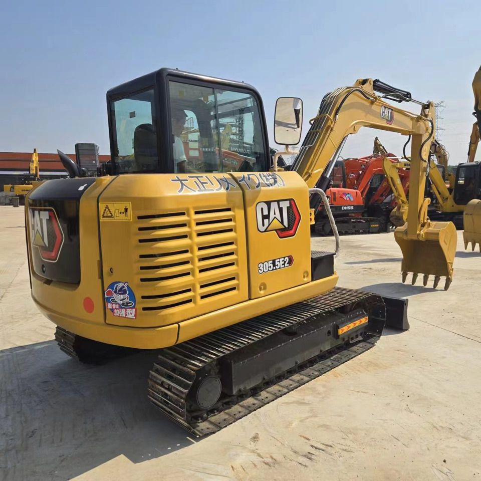 2022 Caterpillar 305.5E2 mini excavator, rear three-quarter view