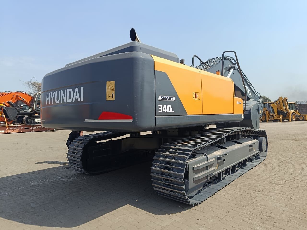 2025 Hyundai R340 Crawler Excavator showcasing its robust dark grey tracks and undercarriage. 2025 Hyundai R340 Crawler Excavator showcasing its robust dark grey tracks and undercarriage.