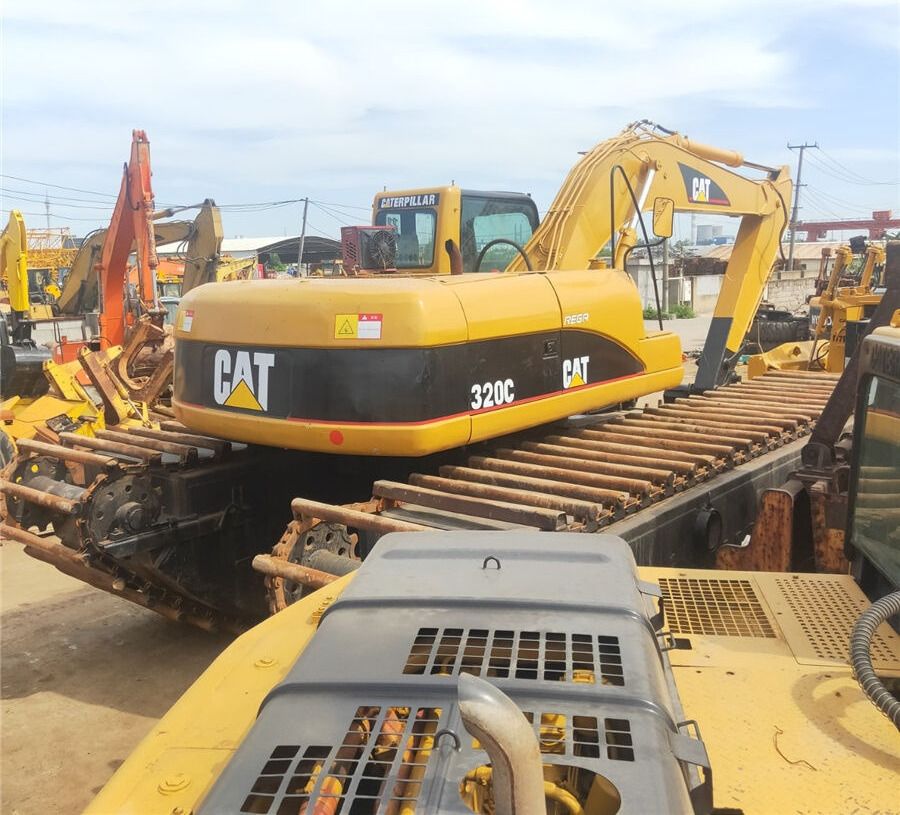 2010 Caterpillar 320C amphibious excavator, rear three-quarter view
