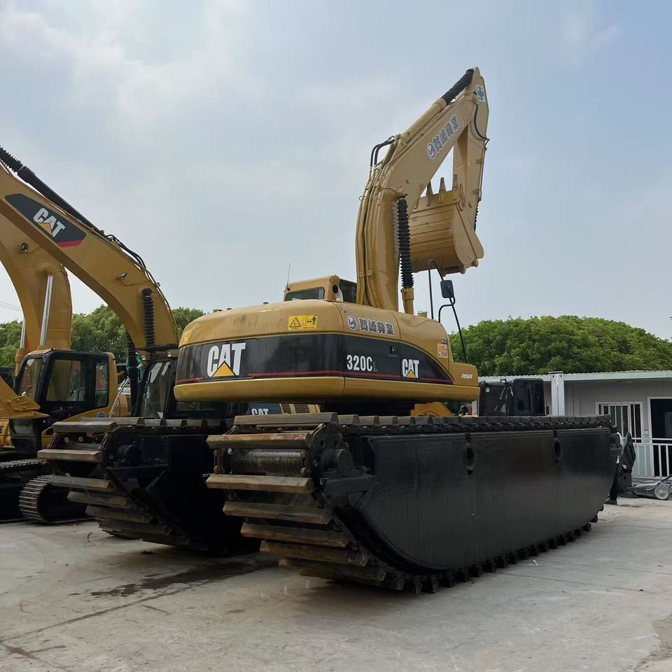 2022 Caterpillar 320CL amphibious excavator, rear three-quarter view