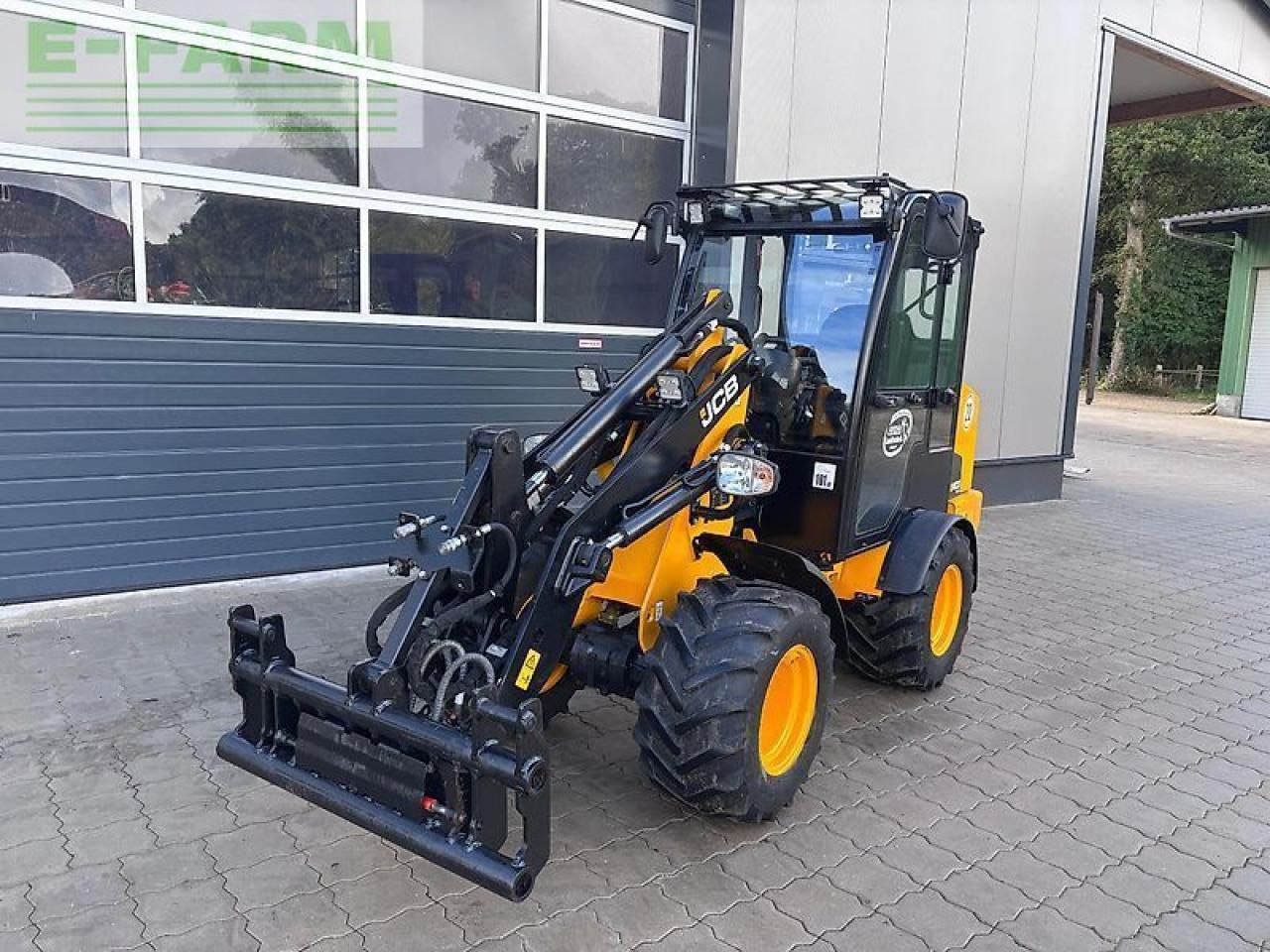 2024 JCB 403PLUS wheel loader, front three-quarter view