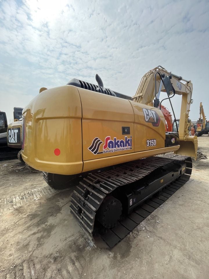 2023 Caterpillar 315D crawler excavator, rear three-quarter view