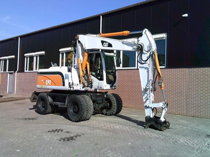 2011 Caterpillar M313D wheel excavator, side profile view