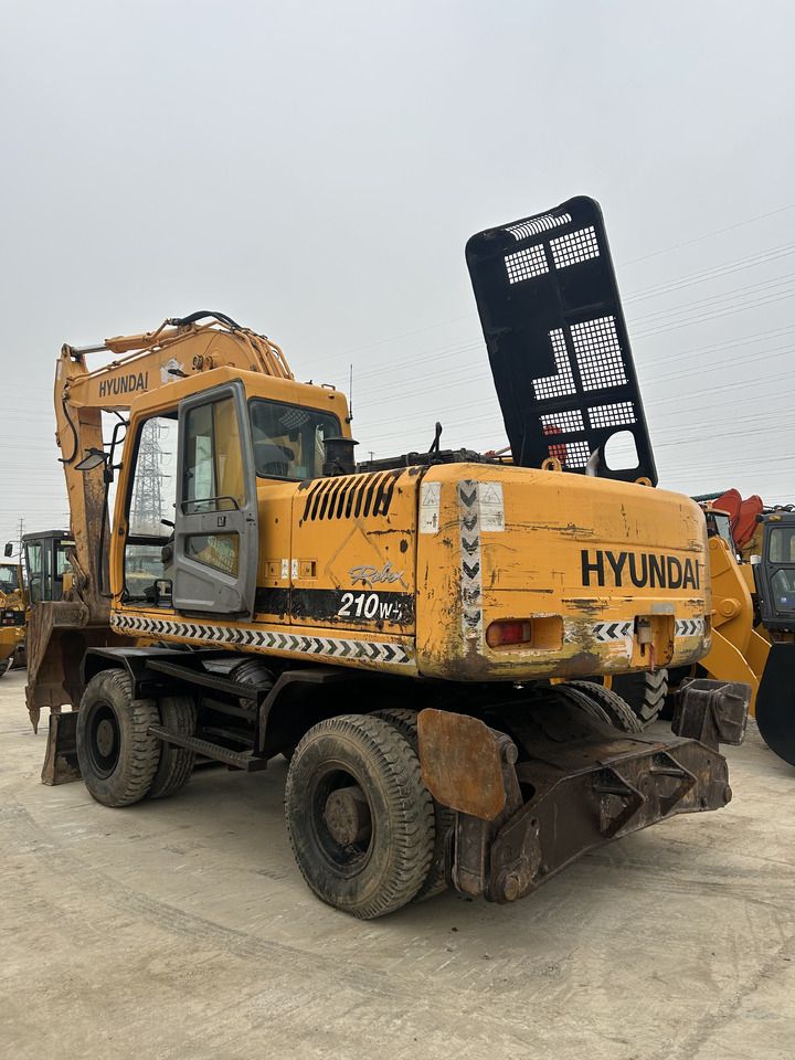 2020 Hyundai R210W-9 wheel excavator, rear three-quarter view