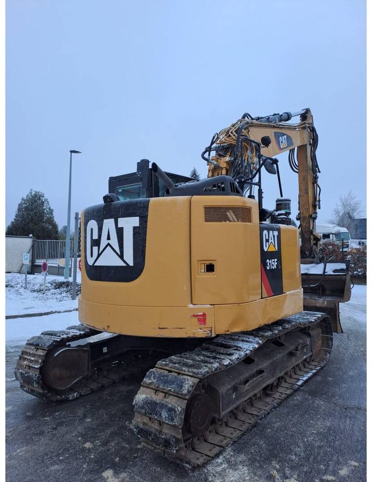 2018 Caterpillar 315F crawler excavator rear three-quarter view