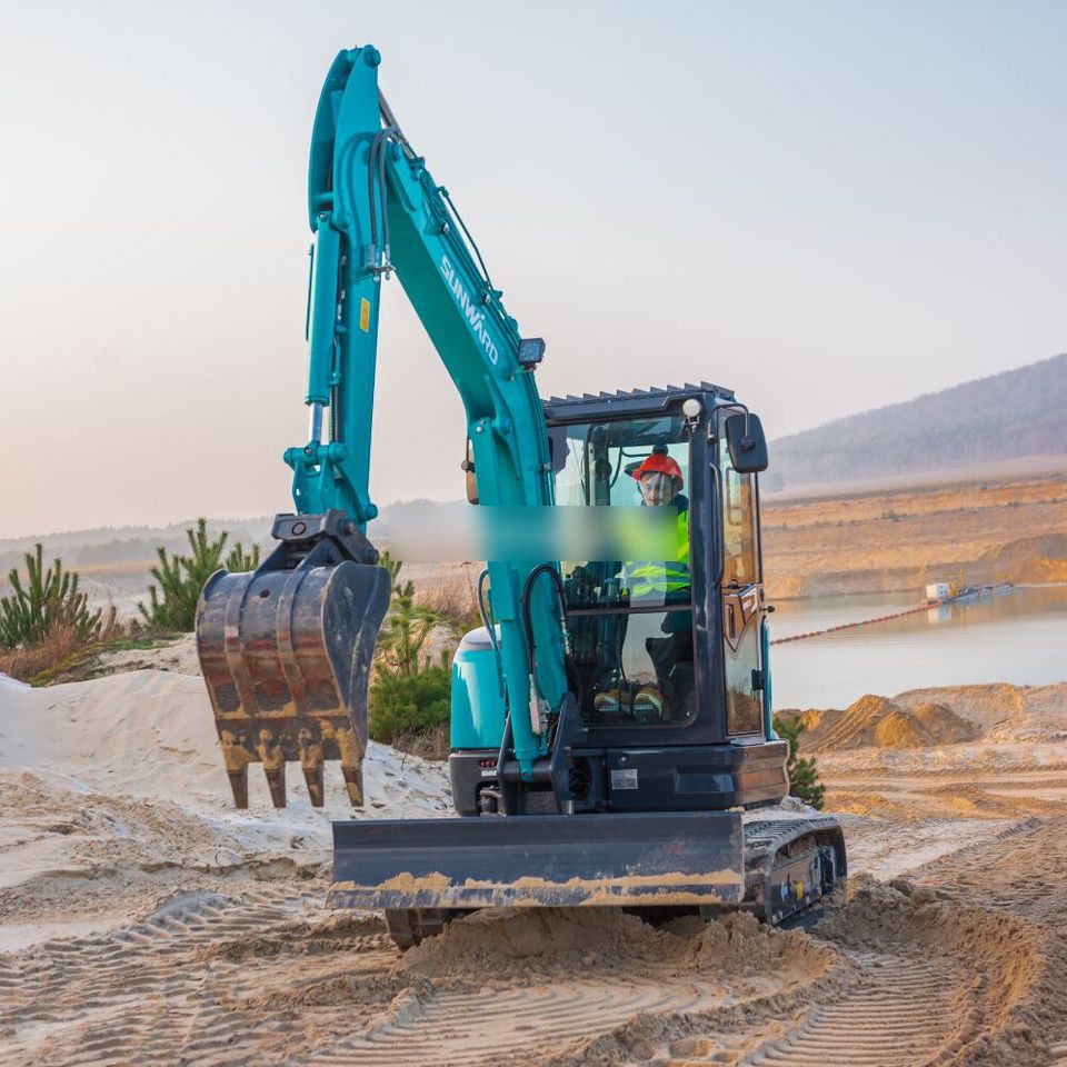 2026 Sunward SWE35UF Mini Excavator with a teal body and a rear view of the operator station.