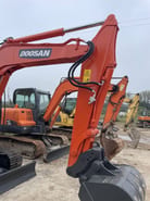 2023 Doosan DX60-9C mini excavator, front three-quarter view