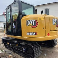 2023 Caterpillar 307E2 crawler excavator, rear three-quarter view