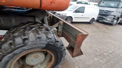 1990 Atlas 1604K wheel excavator rear view with dozer blade