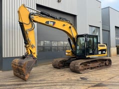 2011 Caterpillar 319DL crawler excavator, side view