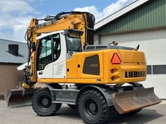 2015 Liebherr A914 wheel excavator, rear three-quarter view