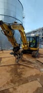2022 Komatsu PC88MR-11EO mini excavator, side view with fork attachment 2022 Komatsu PC88MR-11EO mini excavator, side view with fork attachment