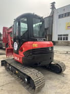 Kubota U55-4 crawler excavator, front three-quarter view