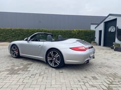 2009 Porsche 997.2 4S convertible, rear three-quarter view