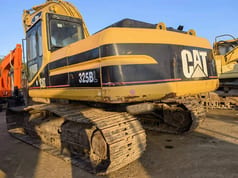2010 Caterpillar 325BL crawler excavator rear three-quarter view