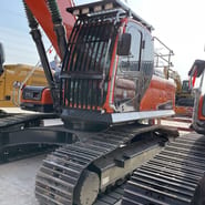 Doosan DX300 crawler excavator, side view of the cab and tracks