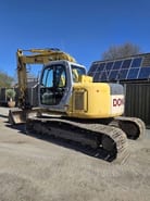 2006 New Holland E135SR-1E crawler excavator, rear three-quarter view