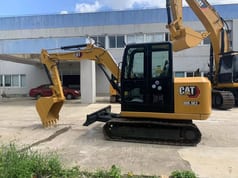 2022 Caterpillar 305.5E2 mini excavator side view