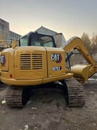 2024 Caterpillar 307E2 mini excavator, rear three-quarter view