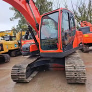 2022 Hitachi DX140 excavator, front three-quarter view