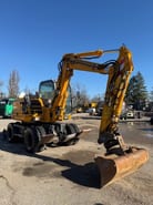 2012 New Holland MH 2.6 wheel excavator, side view