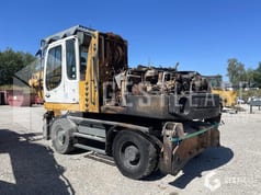 2010 Liebherr A316 wheel excavator, rear three-quarter view