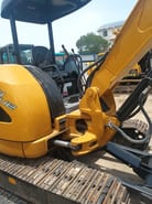 2024 Caterpillar 304C mini excavator cab and boom view