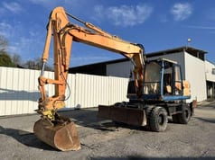 1997 Caterpillar M315 wheel excavator, side view