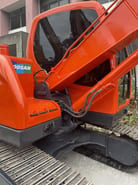 2020 Doosan DX75-9C crawler excavator, side view of cab and boom