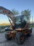2006 CASE WX145 wheel excavator, front three-quarter view