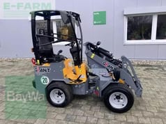 2023 Giant G1200 Mini Excavator with a grey and yellow body, showing the operator's station and controls from the side. 2023 Giant G1200 Mini Excavator with a grey and yellow body, showing the operator's station and controls from the side.