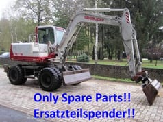 2000 Takeuchi TB070W wheel excavator side view