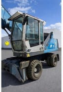 2010 Fuchs MHL320 material handler, front three-quarter view