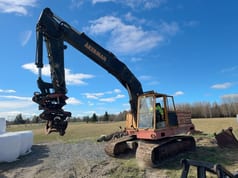 1977 Åkerman H12B excavator, side view with grapple attachment 1977 Åkerman H12B excavator, side view with grapple attachment
